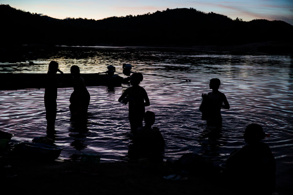 People bathing in a river in Myanmar